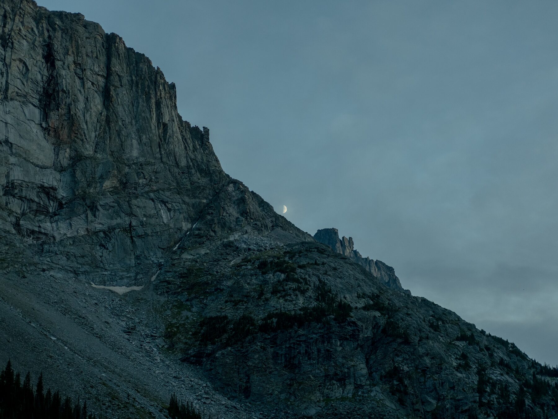 Blue granite face in evening shadow